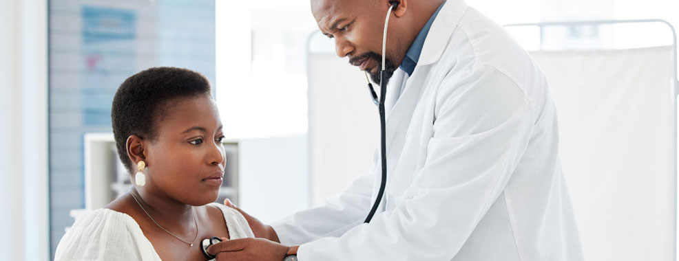 Woman getting her heartbeat rate taken by a Kelsey Seybold Provider