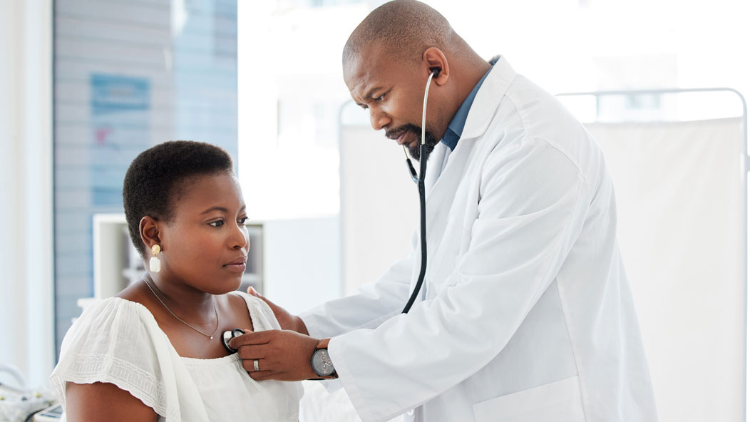 Woman getting her heartbeat rate taken by a Kelsey Seybold Provider