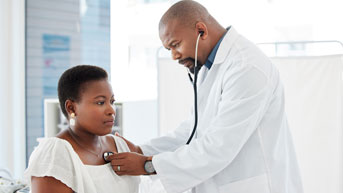 Woman getting her heartbeat rate taken by a Kelsey Seybold Provider
