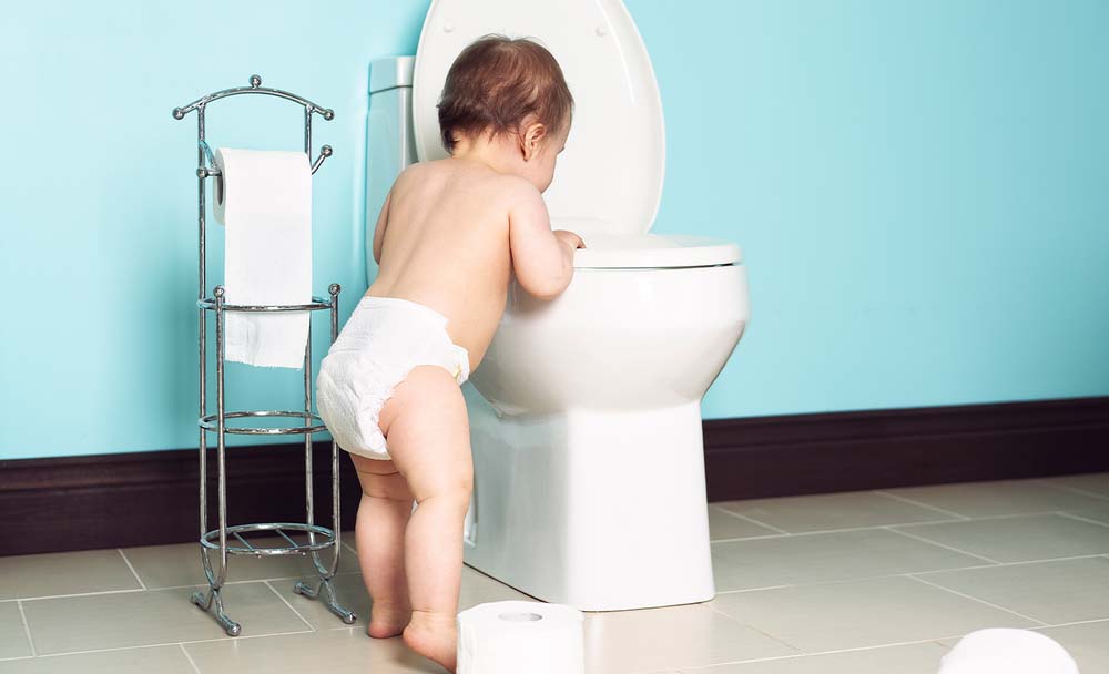 Child Looking at a Toilet