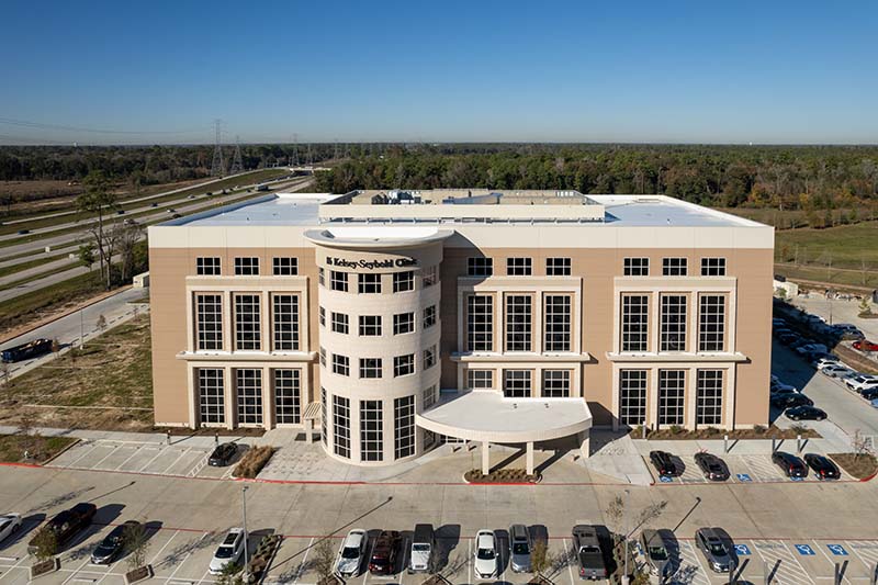A front exterior aerial view of Kelsey-Seybold's Springwoods Village location.