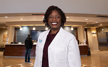 Kelsey-Seybold provider Faundra Armstrong stands in the lobby of our Summer Creek Clinic.