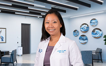 Jennie Ou, MD, OB/GYN specialist, stands in the lobby of Kelsey Seybold's South Shore Harbour Clinic.