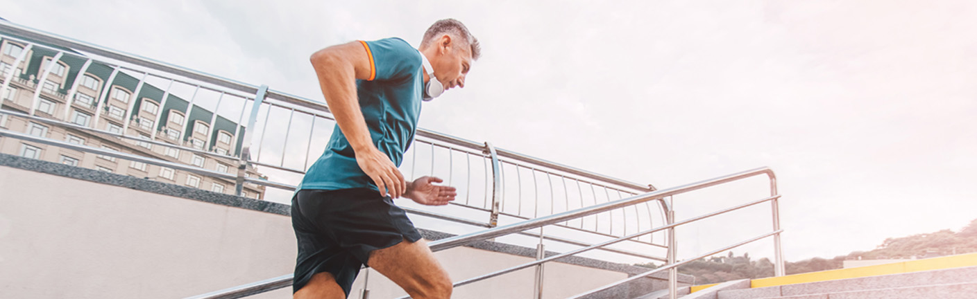 A runner ascends a set of stairs.