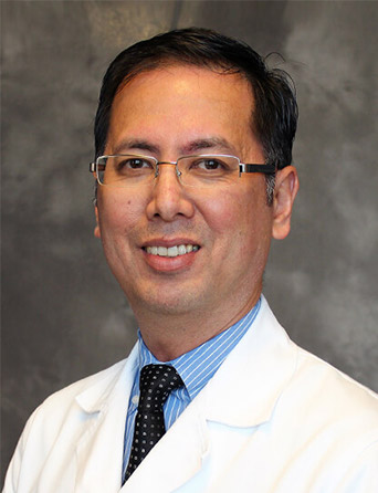 Portrait of Dennis Ferrer, MD, Endocrinology specialist at Kelsey-Seybold Clinic.