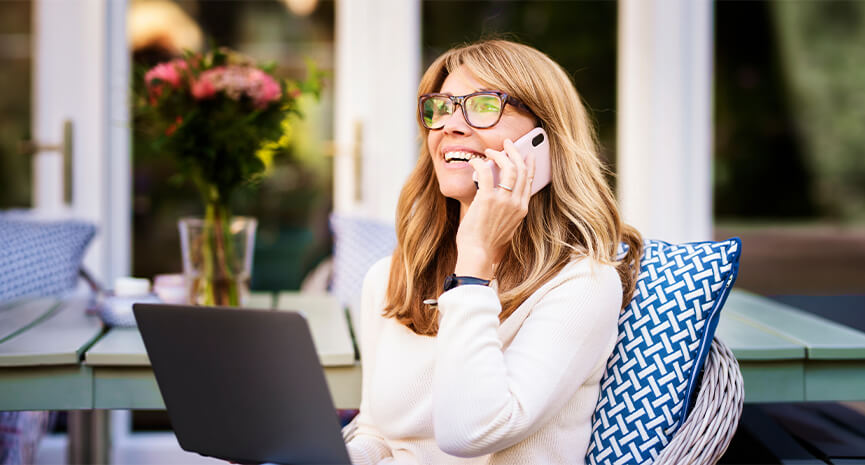 Woman on the phone at her laptop