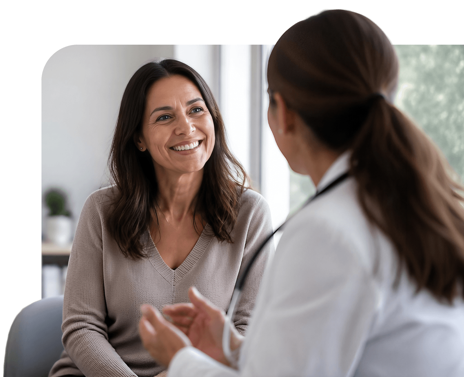 Smiling woman talking to Kelsey-Seybold Clinic Menopause Care provider