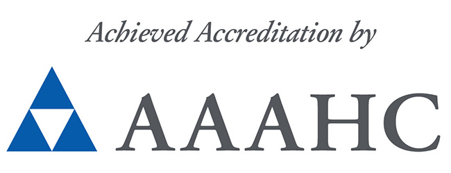 Badge with text reading, Achieved accreditation by AAAHC, issued by the Accreditation Association for Ambulatory Health Care, Inc.
